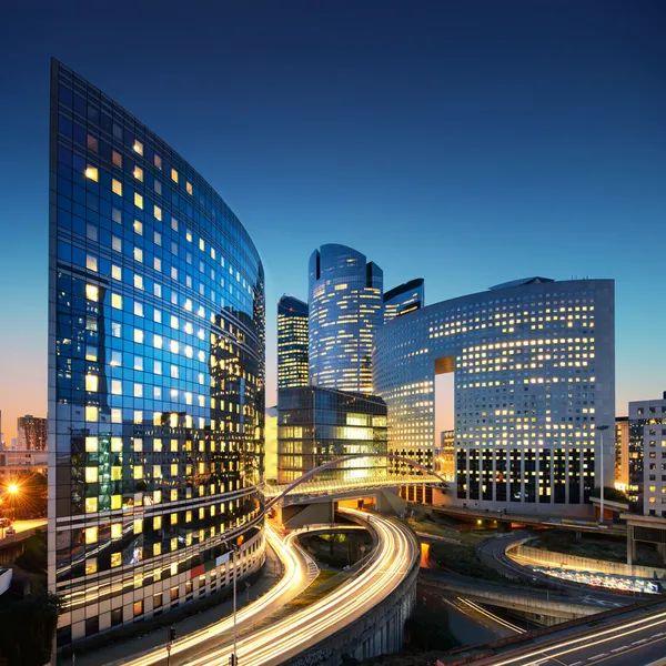 Office towers in a business district at dusk