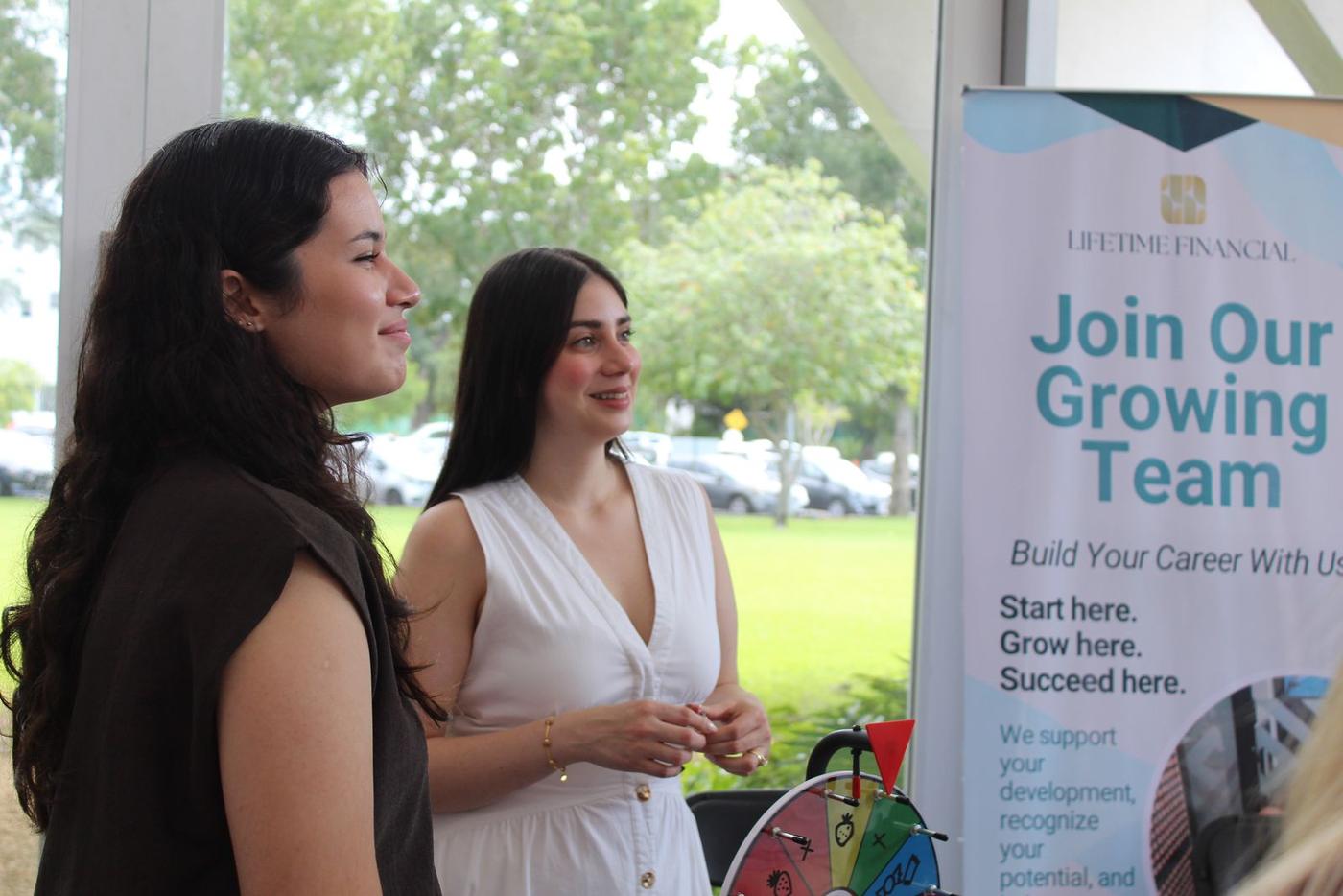 Two Lifetime Financial team members at a career fair booth